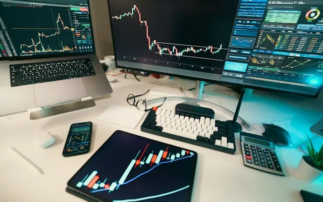 Trading desk with financial charts and technology displays